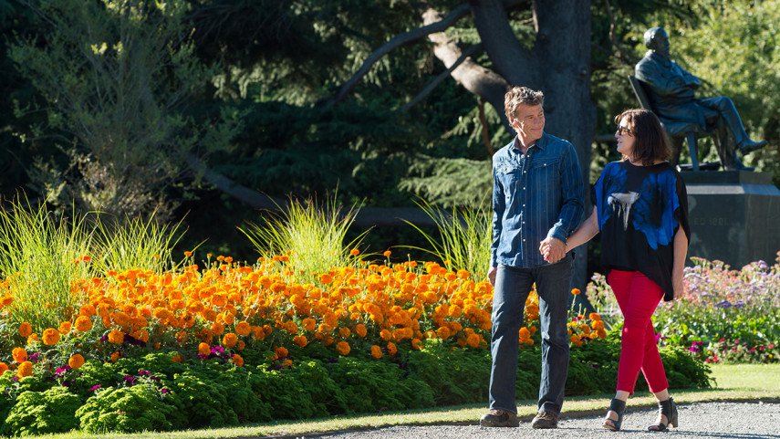 Two people walking through the Christchurch Botanic Gardens