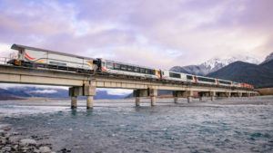 The TranzAlpine Scenic Train goes over a bridge